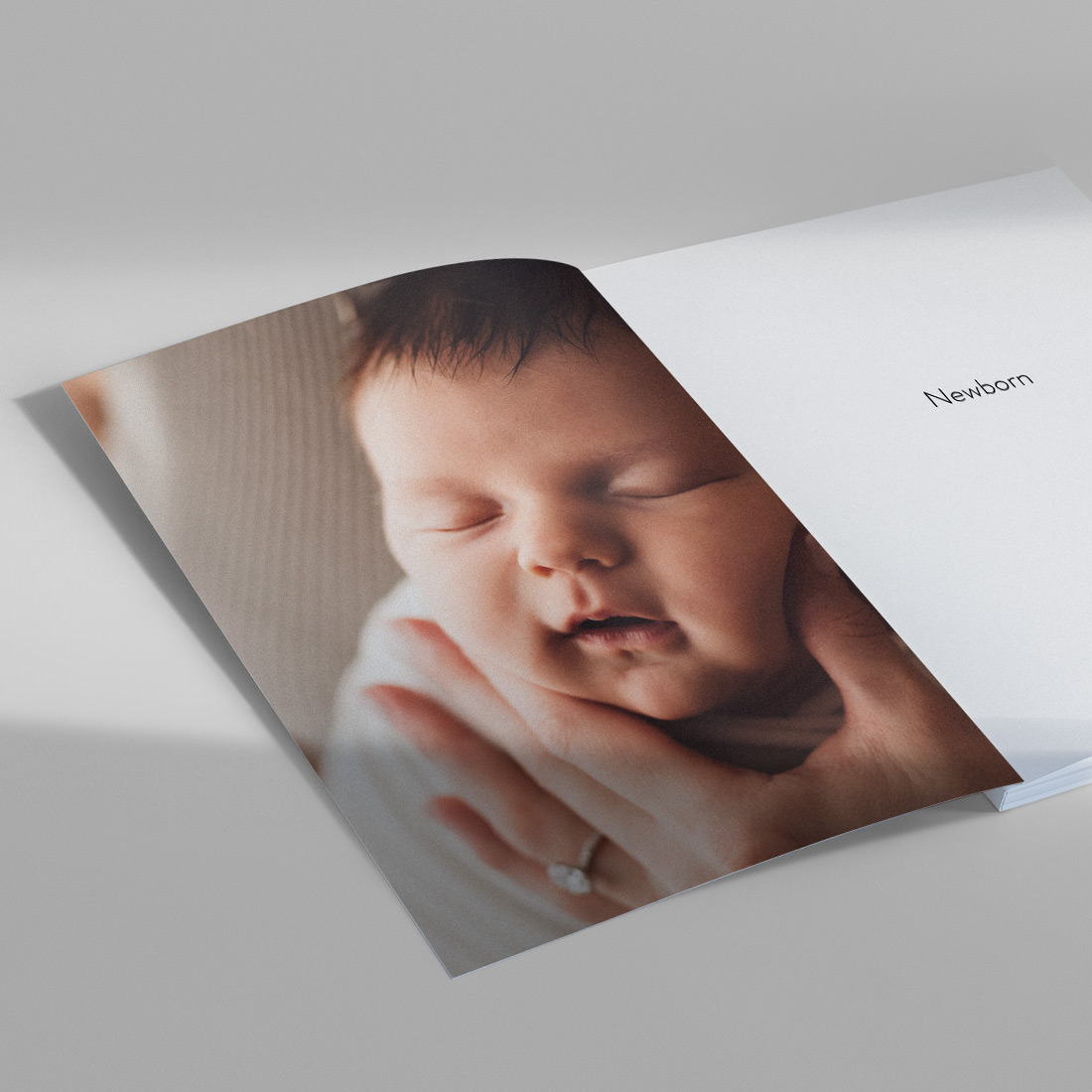 Open Baby Magazine with photo of sleeping baby on spread