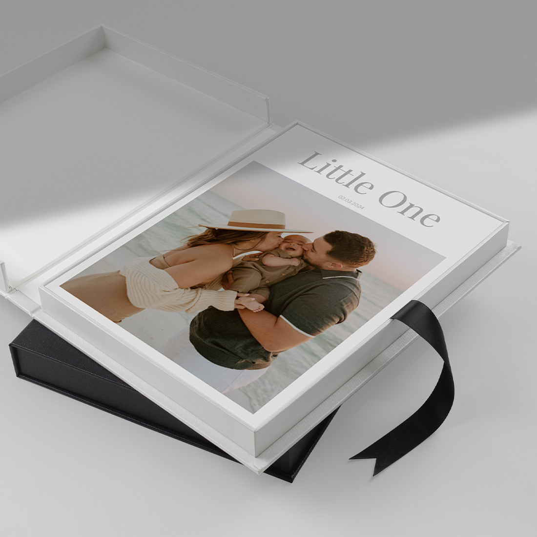 Black Buckram Magazine Presentation Box open to display Baby Magazine stacked on top