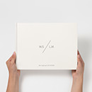 Hands holding the Landscape Wedding Guest Book