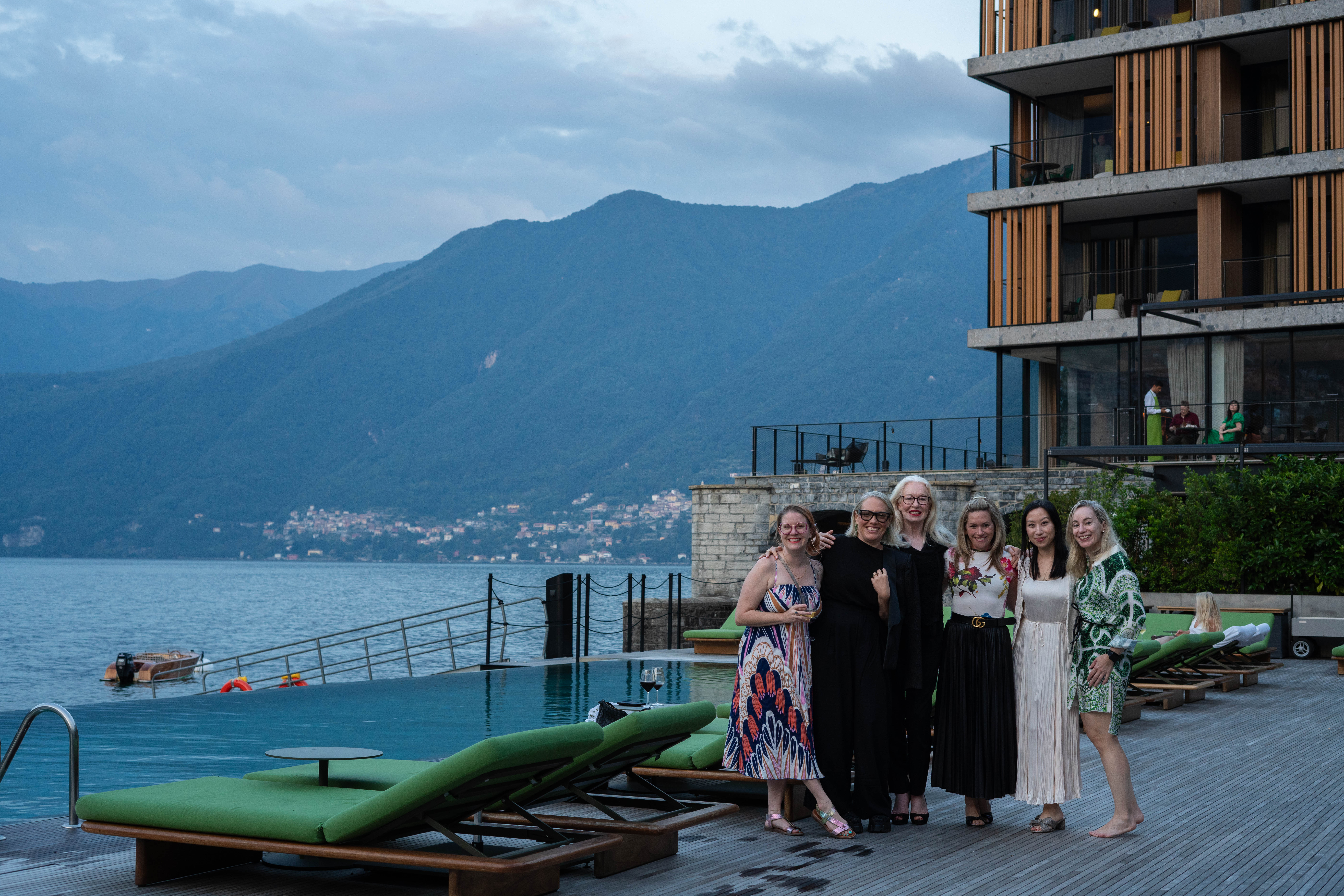 View of friends in front of the ocean and mountains