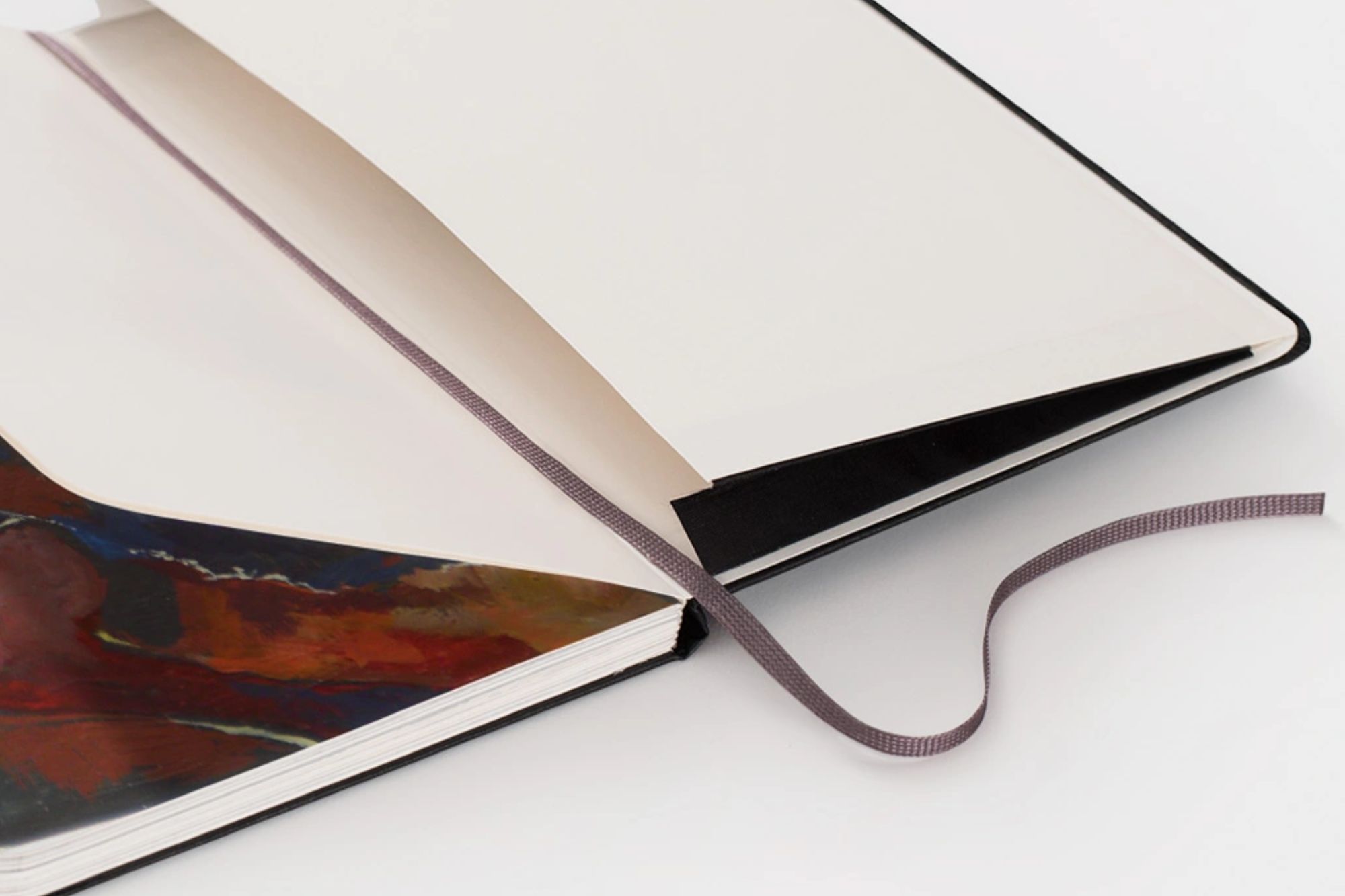 Moleskine book layed flat with string