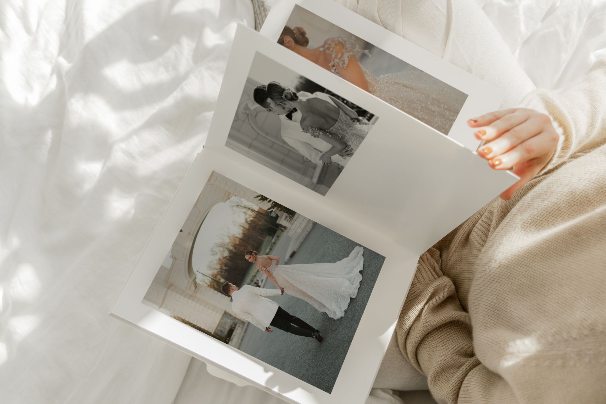 Person flicking through Premium Photo Album with wedding photos