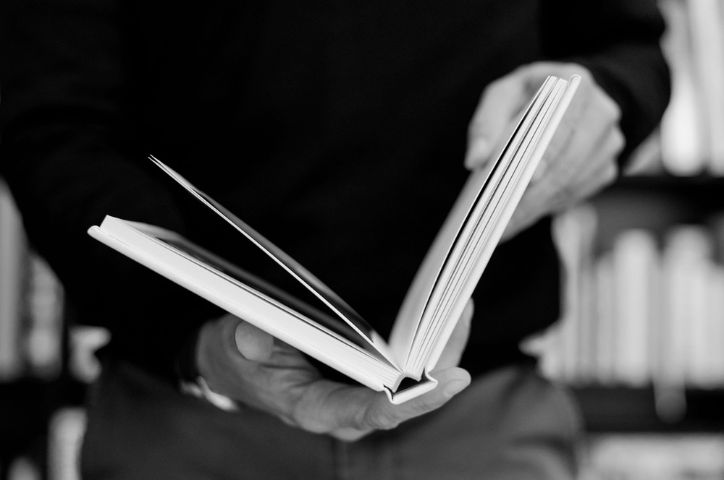 Spine of a book some one is fipping through