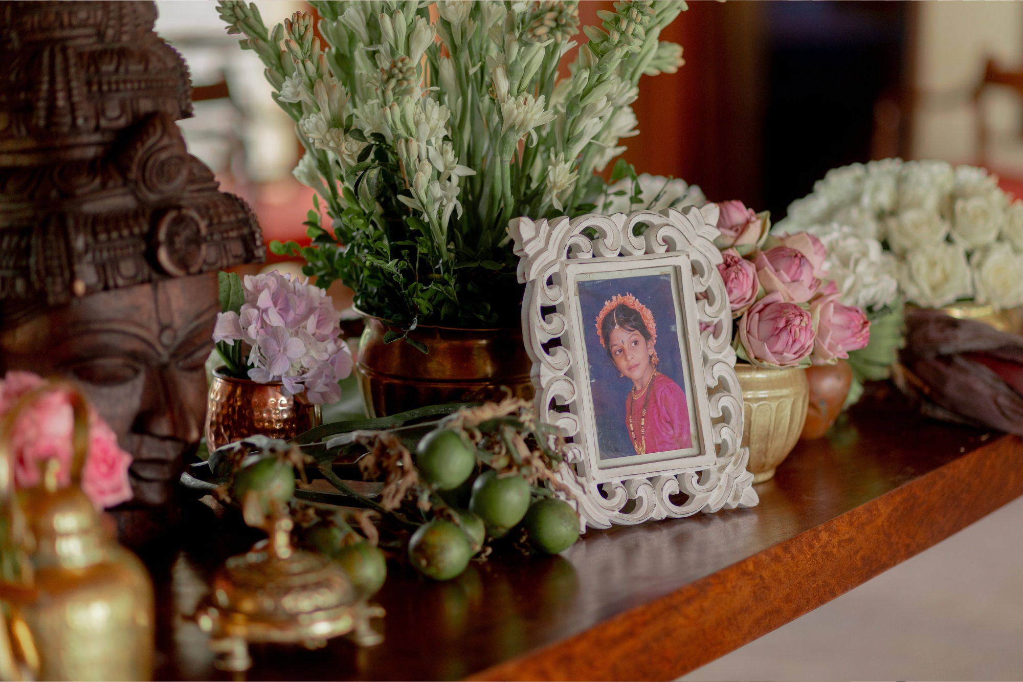 Mantel piece with photo frame of little girl on it