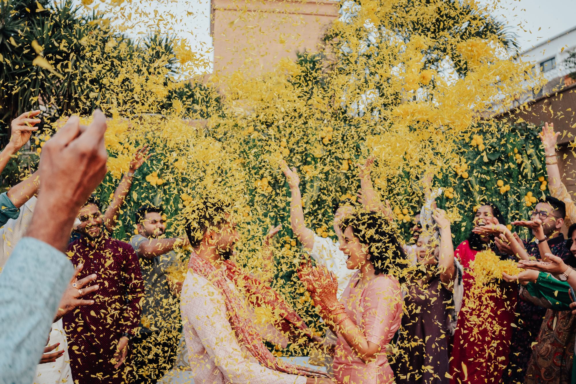 Couple under yellow confetti